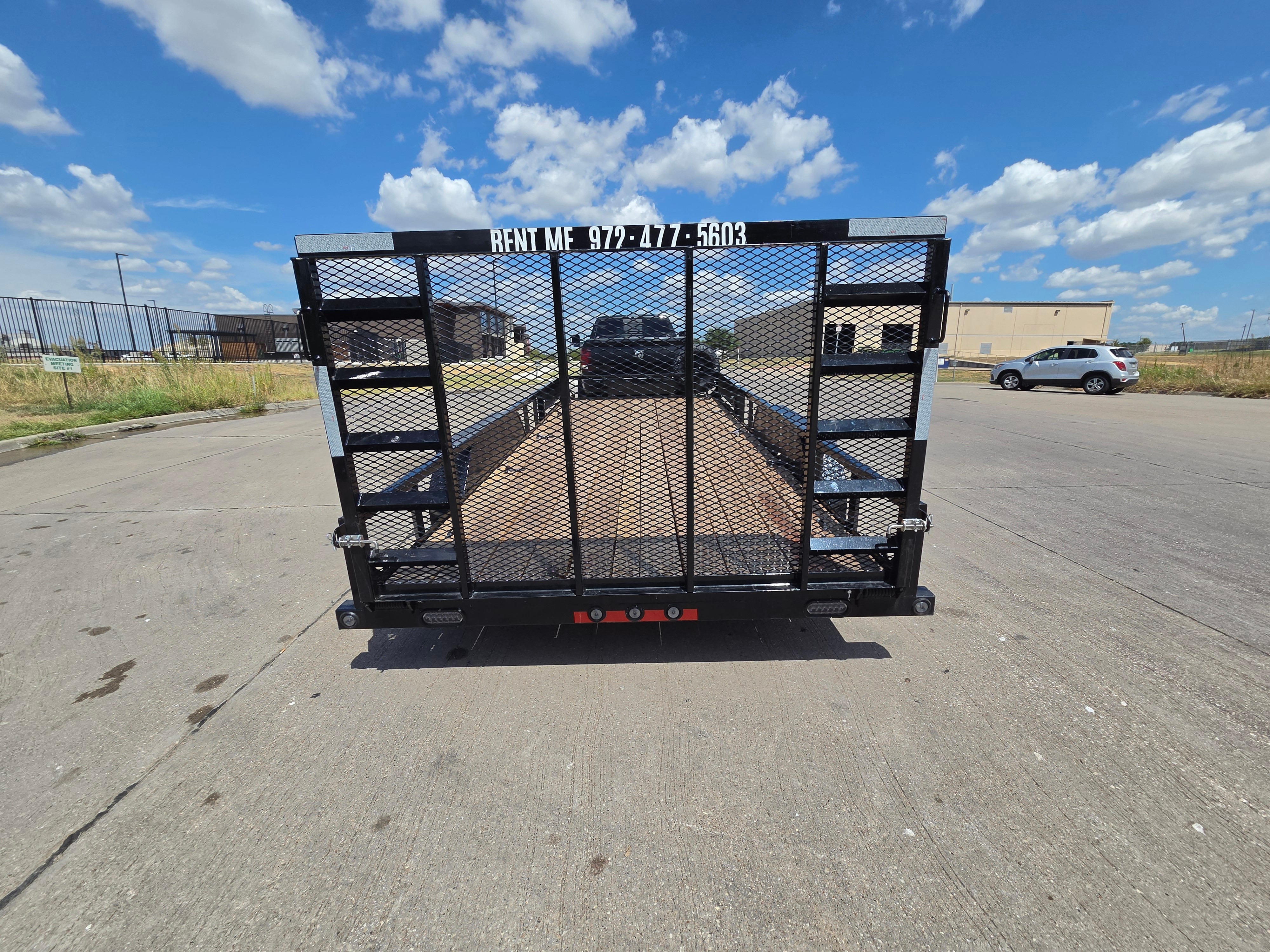 Load Trail UT18 utility trailer rear view with mesh ramp gate